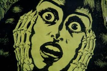 A drawing of a horrified woman's face clasped by skeletal hands