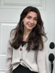 A headshot of Elora Copeland smiling