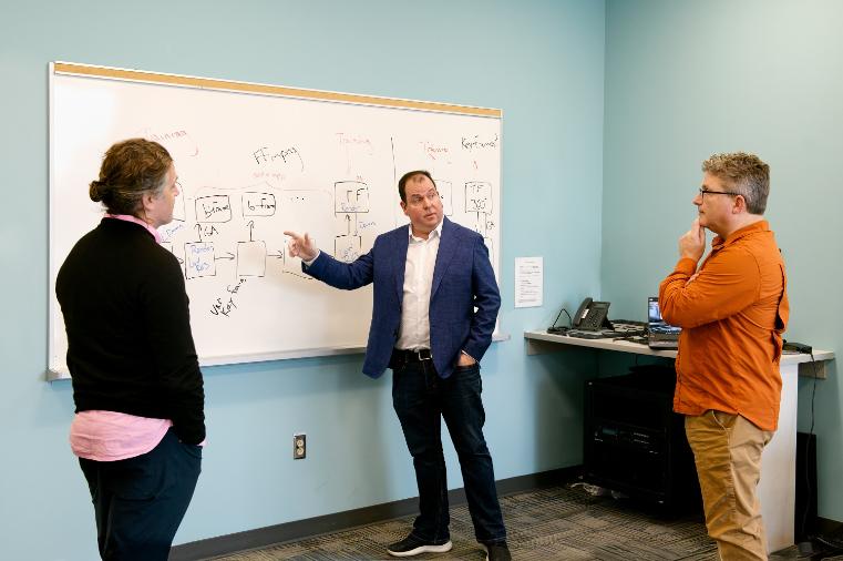 Dr. Jason Rhinelander meeting with collaborators