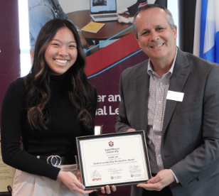 Student receiving award